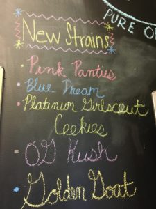 chalkboard menu in a dispensary